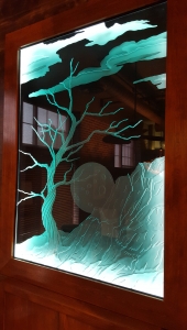 Moon and tree glass carving by Glass Graphics of Atlanta.