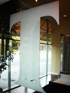 Office glass partition with glass carving created and installed by Glass Graphics of Atlanta.