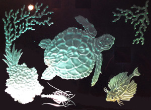 Glass carving under-sea scene by Glass Graphics of Atlanta.