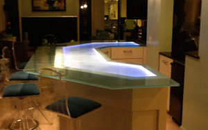 Sandblasted / frosted glass counter top with color-changing LED-illumination created and installed by Glass Graphics of Atlanta.