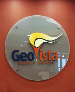 Dimensional letter corporate logo sign on glass panel mounted on stand-offs by Glass Graphics of Atlanta.