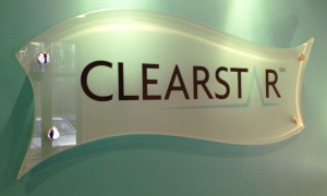 Business office filmed glass sign on stand-off mounting by Glass Graphics of Atlanta.