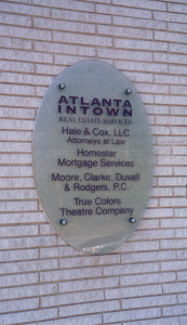 Exterior business office glass sign on stand-off mounting by Glass Graphics of Atlanta.