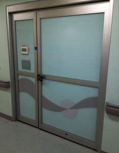 Filmed glass healthcare / medical facility door by Glass Graphics of Atlanta.