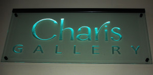 Business office sandblasted sign on stand-off mounting and LED-lighted by Glass Graphics of Atlanta.