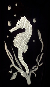 Seahorse scene carved into glass and illuminated with LEDs by Glass Graphics of Atlanta.