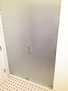 Sandblasted / frosted privacy glass shower enclosure sandblasted and installed by Glass Graphics of Atlanta.