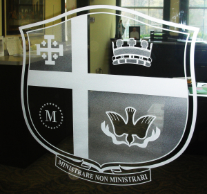Sandblasted glass institutional logo on glass office door by Glass Graphics of Atlanta.