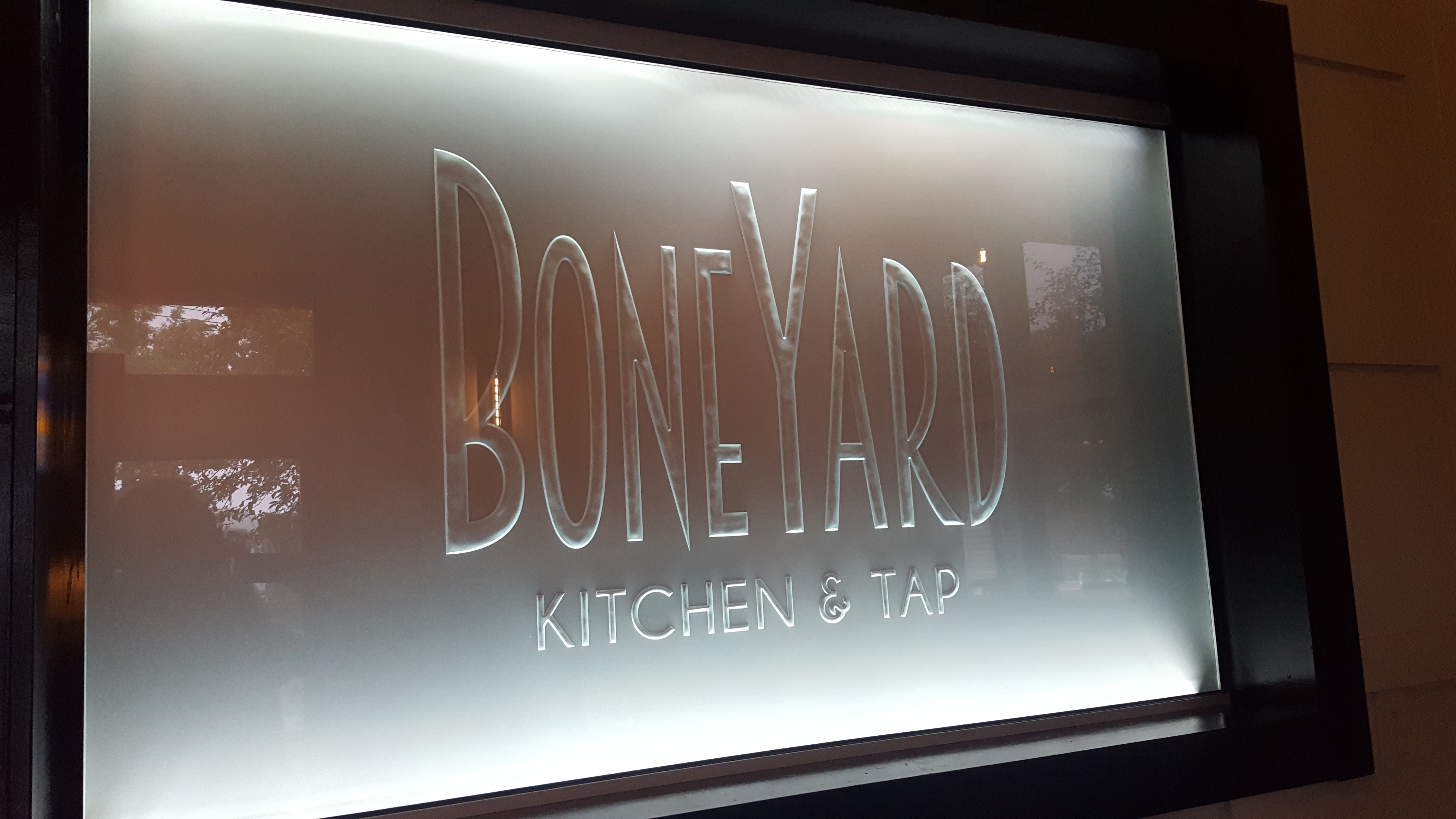 Boneyard Kitchen & Tap sandblasted logo on glass